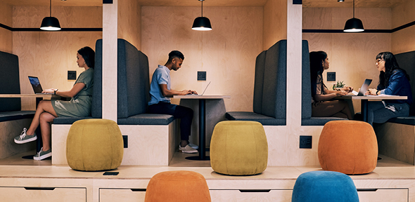 group of professionals talking in a meeting room 