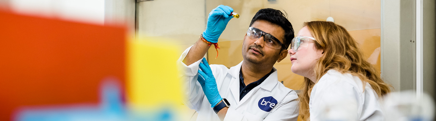 Indoor Environmental Quality picturing two IEQ scientists conducting testing